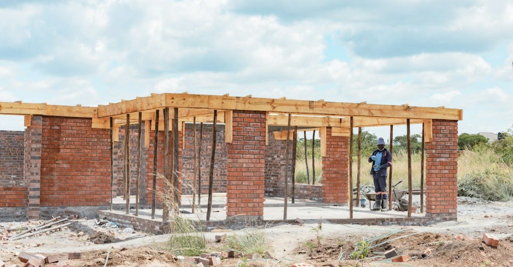 Construction worker inside a building frame