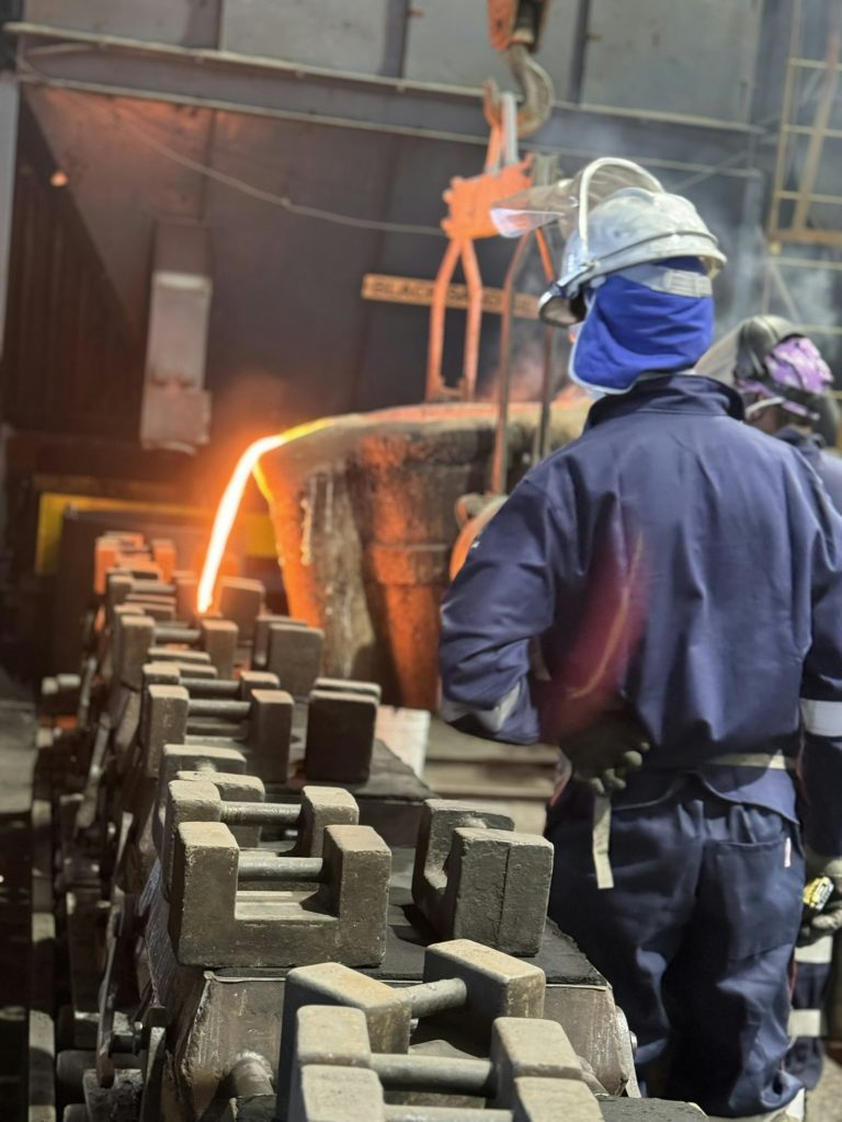Molten metal being poured at a steel plant